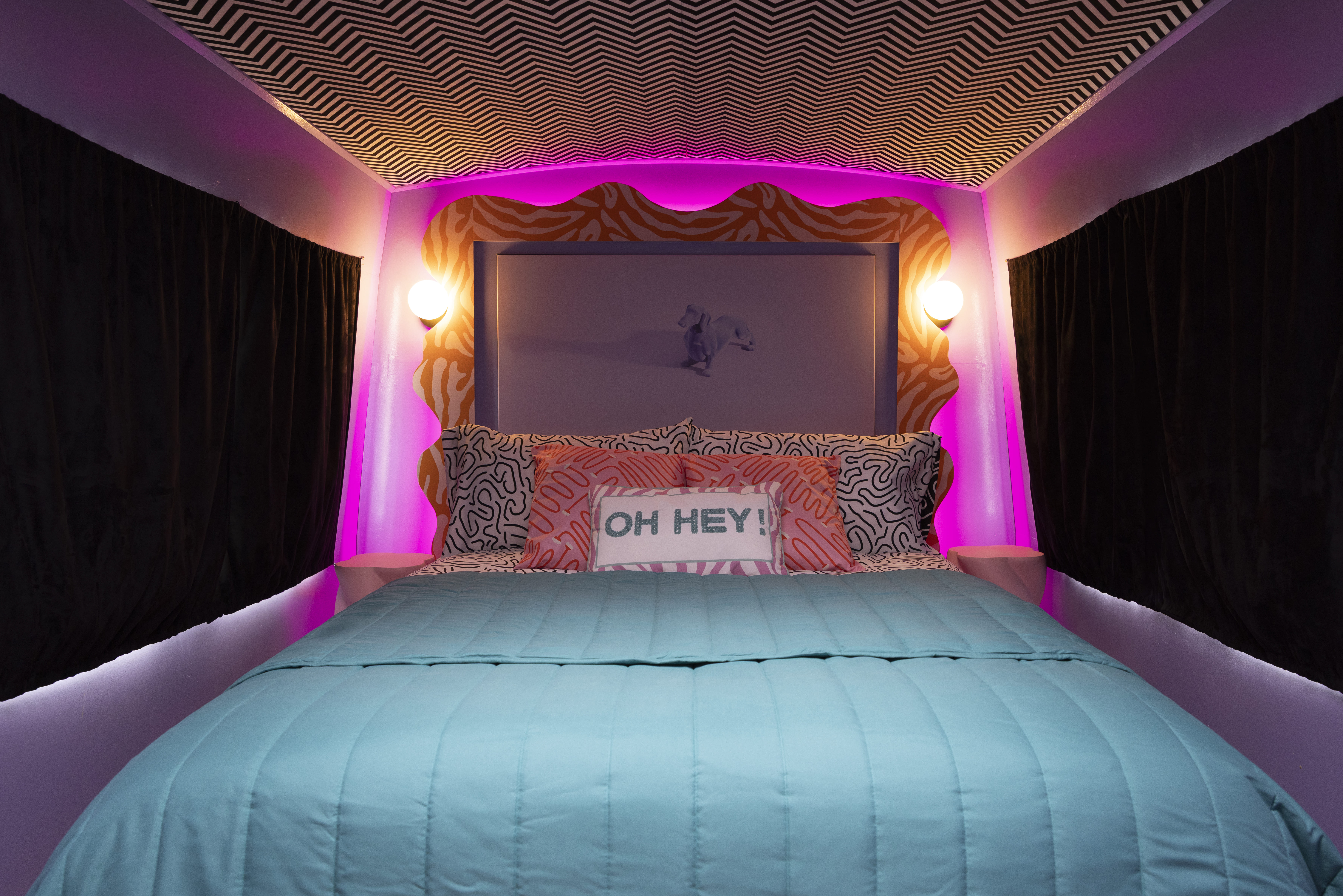 Double bed with pink LED lighting