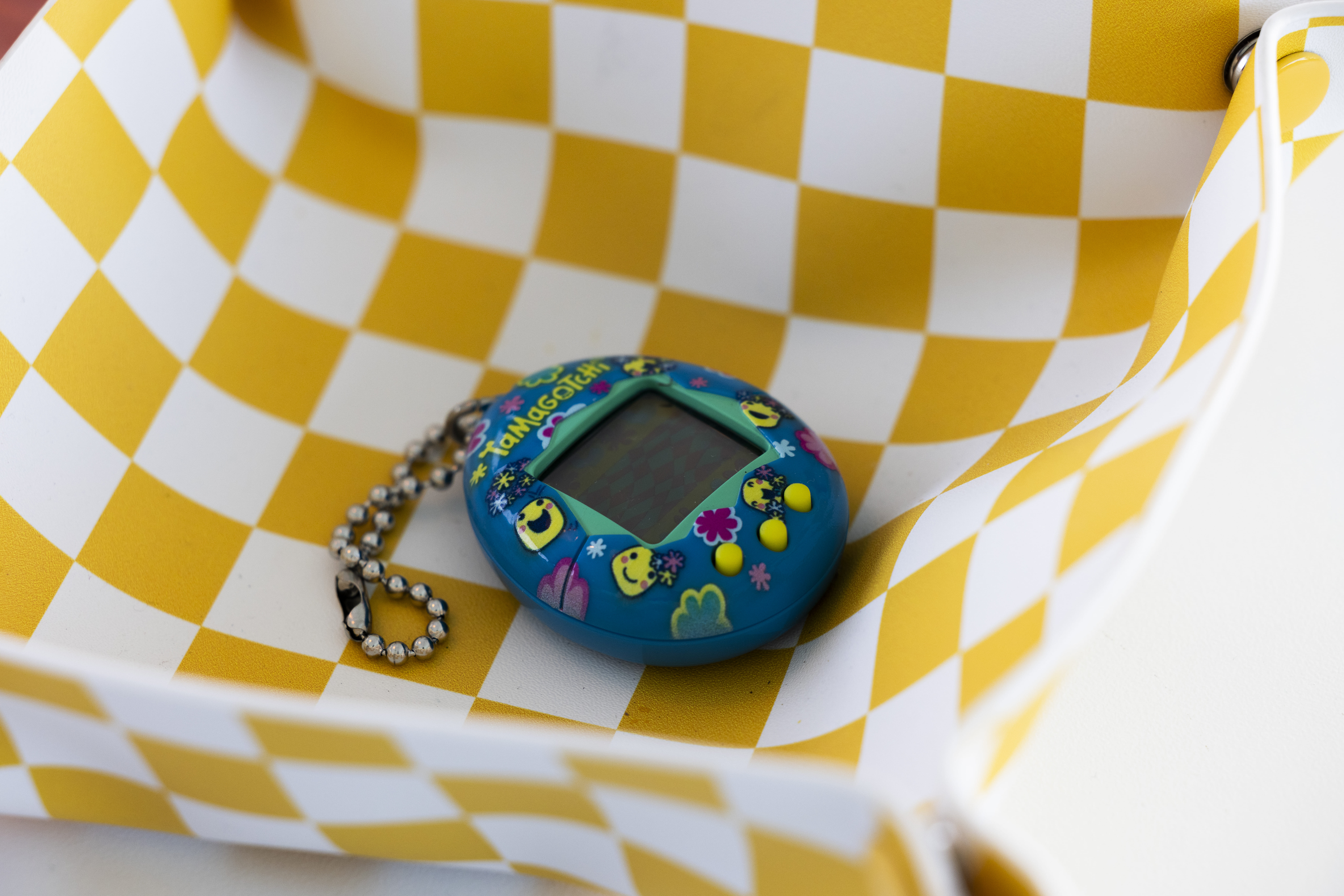 Tamagotchi on checkerboard tray