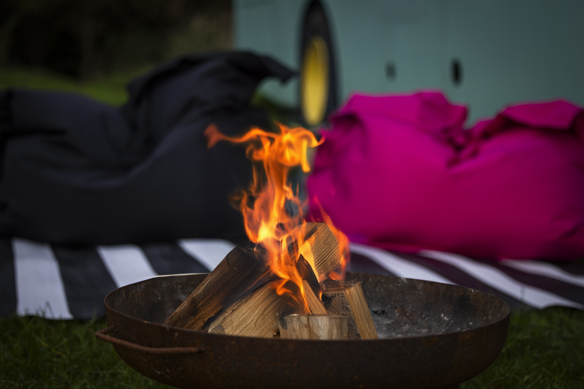 Fire pit outside the bus at night